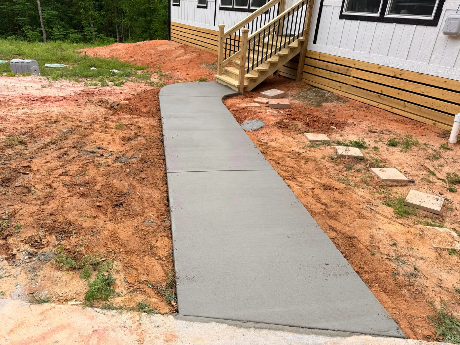 A concrete walkway by Santoyo’s Concrete